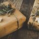 2 packages with brown paper wrapping, greenery and cookies to illustrate our 2020 gift guide