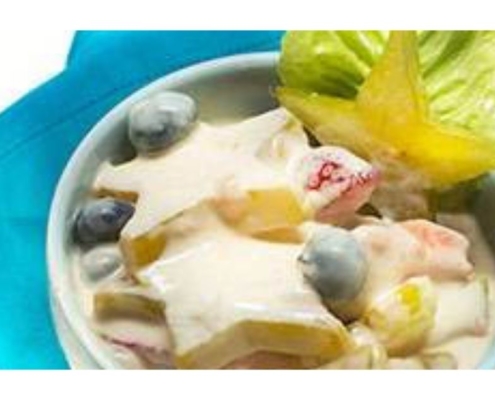 star fruit salad in a bowl with a turquoise napkin