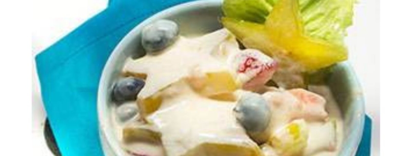 star fruit salad in a bowl with a turquoise napkin