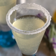 closeup of a lavender lemon drop shooter with a sugar rim