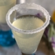 closeup of a lavender lemon drop shooter with a sugar rim