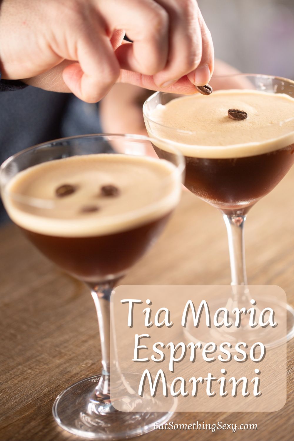 espresso martini graphic with a hand placing espresso bean garnish on two martinis and the text, "Tia Maria espresso martini"