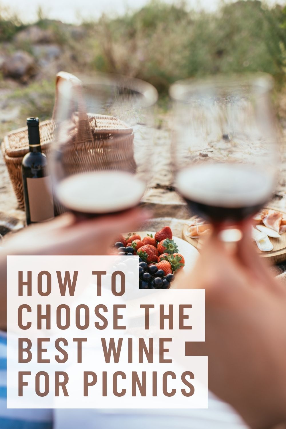 Best wine for picnics graphic with two hands holding wine glasses in the background in front of a beach picnic