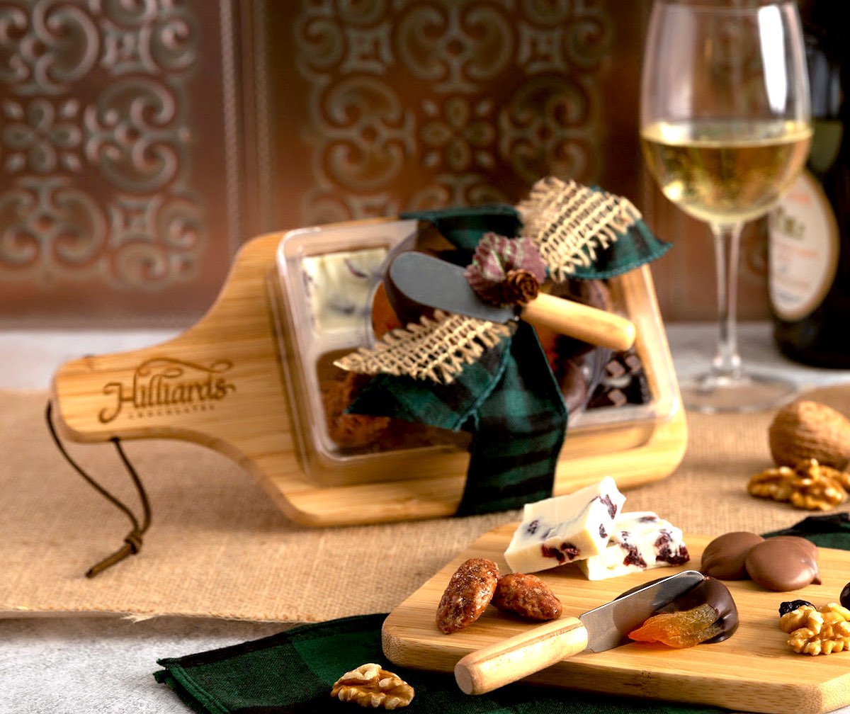 Sample of a Chocuterie board with a glass of white wine in the background