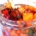 Closeup of cranberry persimmon salsa in a mason jar