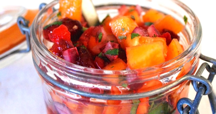 Fuyu Persimmon Salsa With Cranberries, Chile and Lime 1 Closeup of cranberry persimmon salsa in a mason jar
