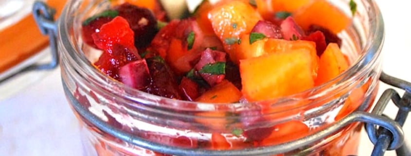 Fuyu Persimmon Salsa With Cranberries, Chile and Lime 1 Closeup of cranberry persimmon salsa in a mason jar