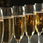 A line of saffron fleurtation cocktails in Champagne flutes