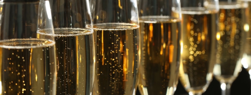 A line of saffron fleurtation cocktails in Champagne flutes