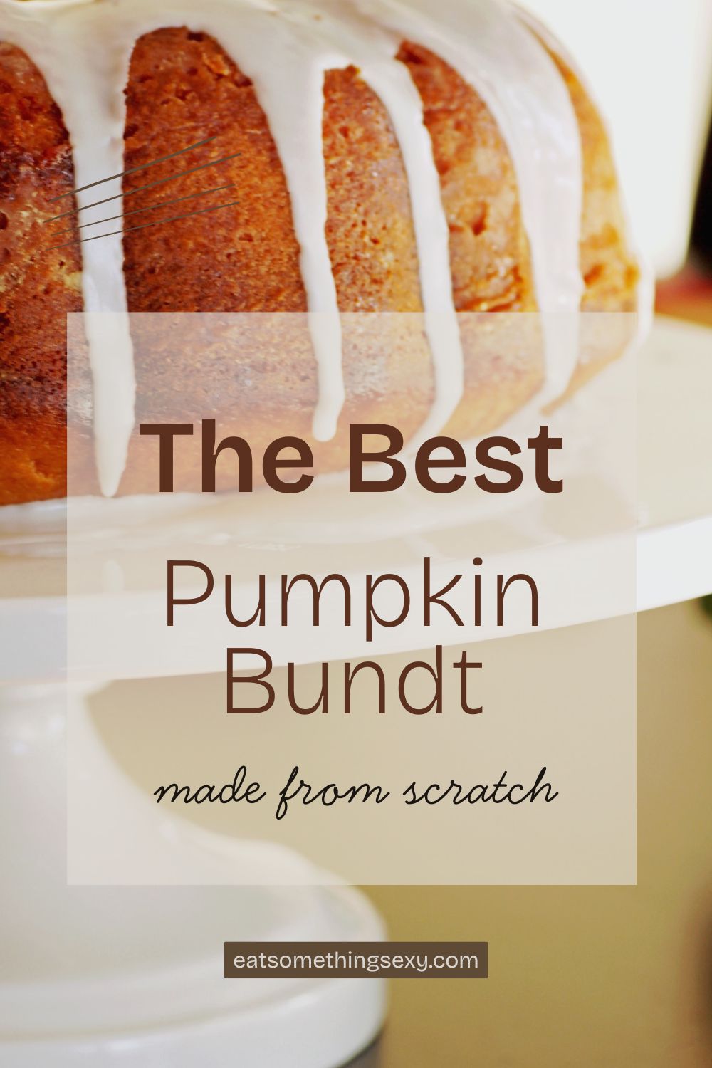 closeup of pumpkin bundt cake with vanilla glaze on a white cake stand and the text, "the best pumpkin bundt made from scratch"