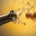 closeup of cork shooting out of a bottle of champagne