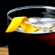 closeup of an espresso old fashioned with a twist of orange