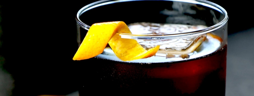 closeup of an espresso old fashioned with a twist of orange