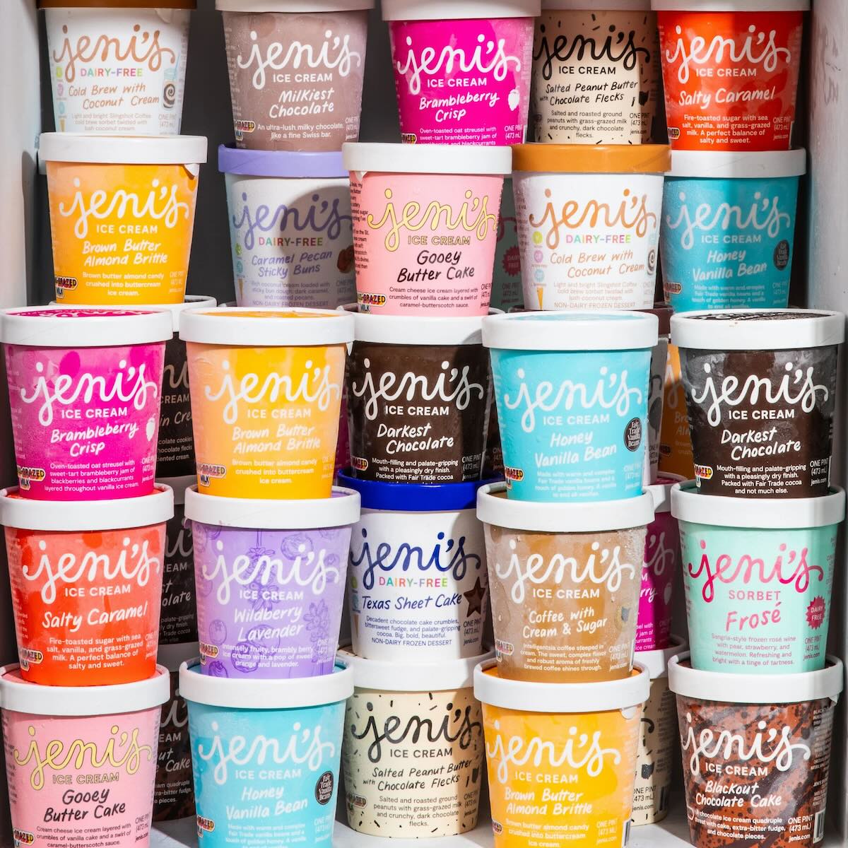 product shot of stacked pints of Jeni's ice cream in colorful packaging