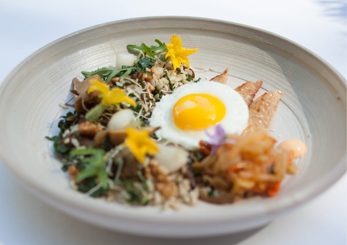 a white pottery dish of gourmet food from the Farmhouse Inn restaurant