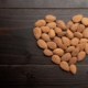 Almond Benefits for Men: Can They Boost Libido, Testosterone & Performance? 31 A closeup of roasted almonds in the shape of a heart on a black background