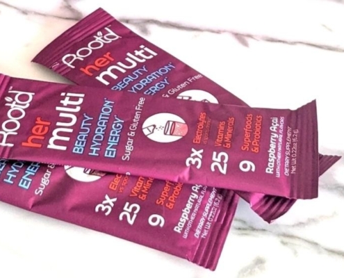 Root'd Her Multi -- the best powder multivitamin we've found 1 Closeup of 3 root'd for her powder multivitamin sleeves on a while marble background