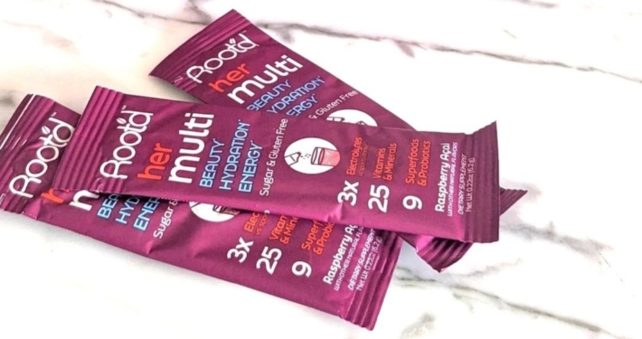 Root'd Her Multi -- the best powder multivitamin we've found 26 Closeup of 3 root'd for her powder multivitamin sleeves on a while marble background