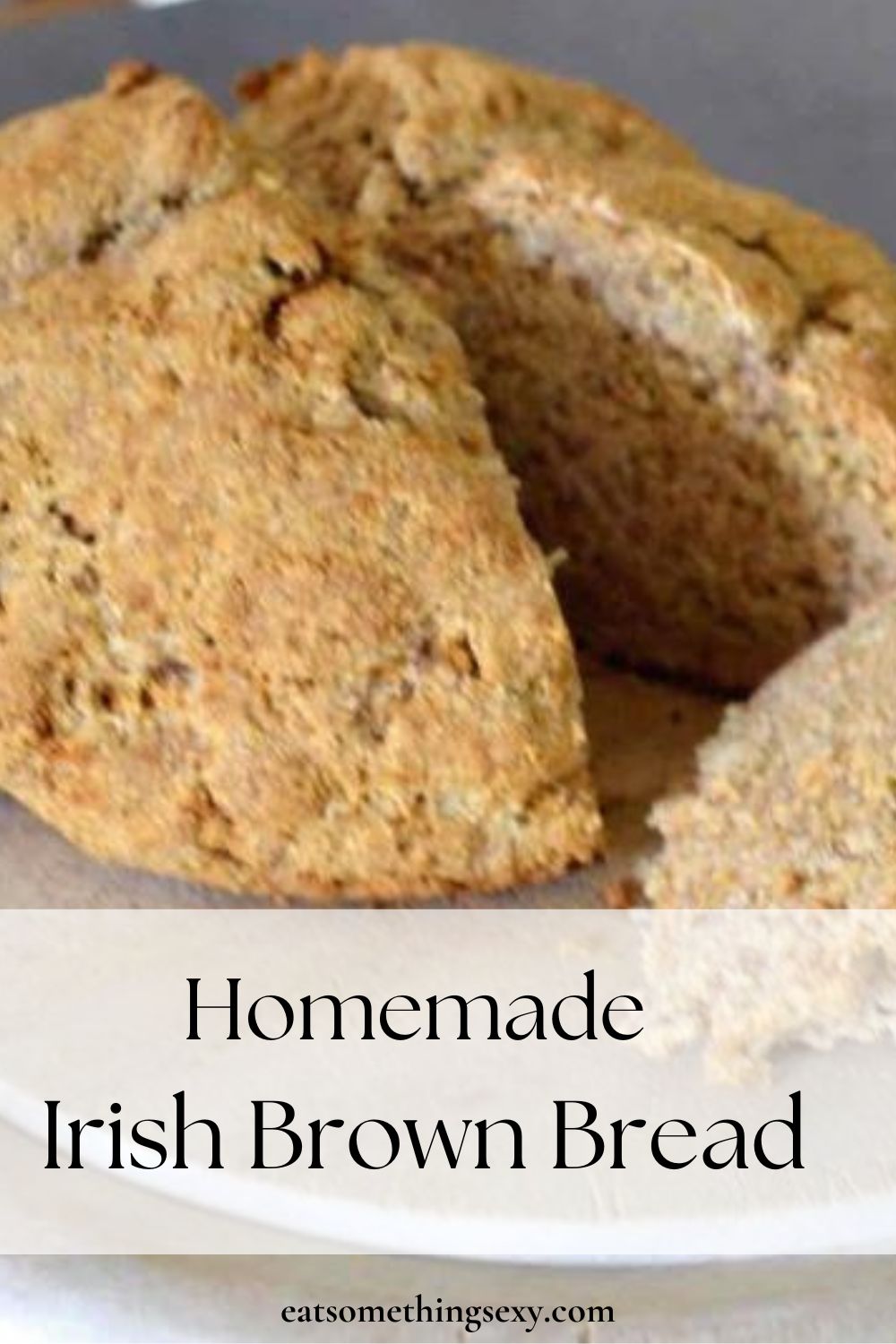 Irish brown bread graphic with a closeup of a loaf on a pale wooden cutting board and the text, "Homemade Irish Brown Bread"